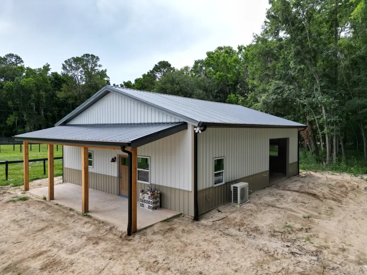 Existing barndominium home in Alachua County, Florida with metal roof and covered porch, financed like a stick-built home